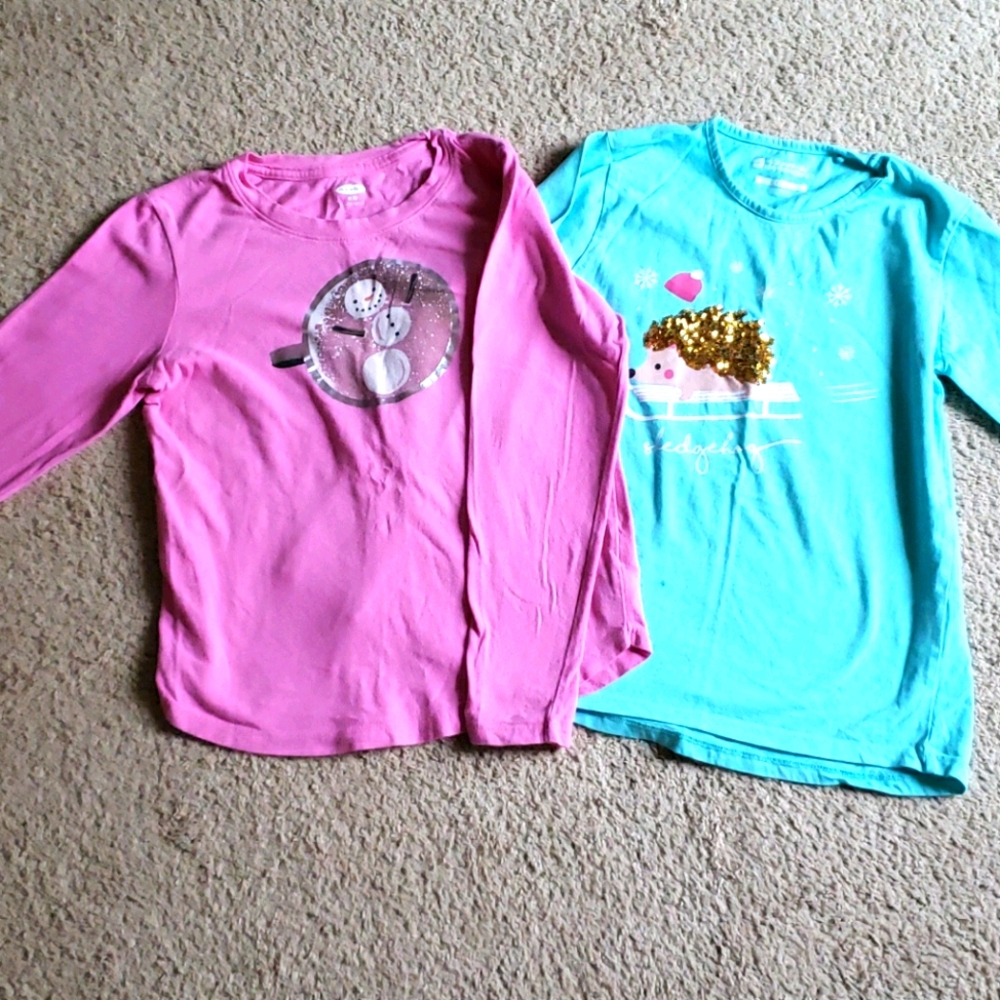 Two girl's long sleeved shirts